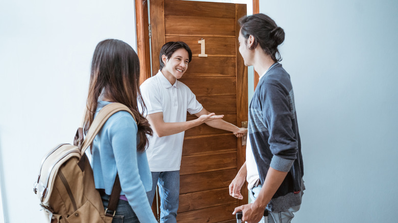 hostel staff welcoming guests