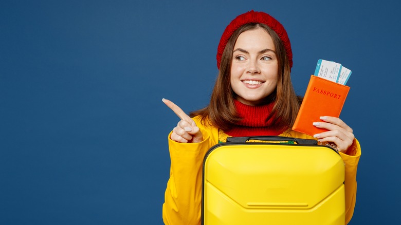 woman holding travel docs