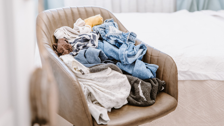 Pile of clothes on a chair.