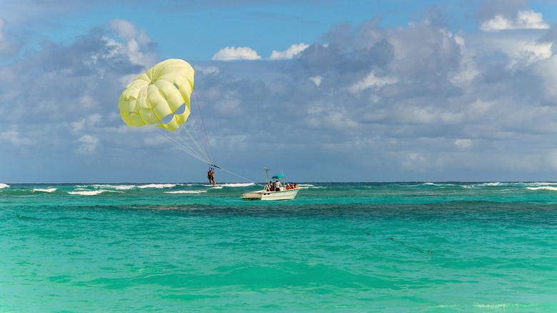 parasailing above turquoise seas