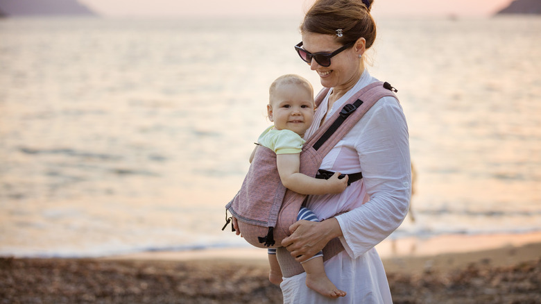 woman baby carrying child