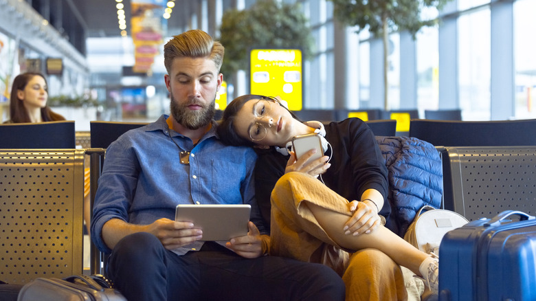 Couple waiting at airport