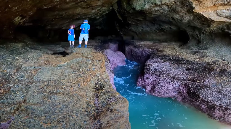 Visitors taking photos in Pink Caves