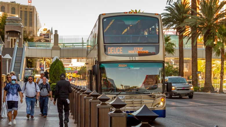 Bus along street with pedestrians