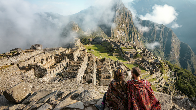 Couple overlooking Machu Picchu