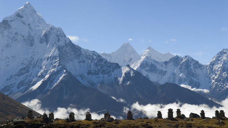 Memorials to Mount Everest's dead on a ridge, Himalayas, Nepal