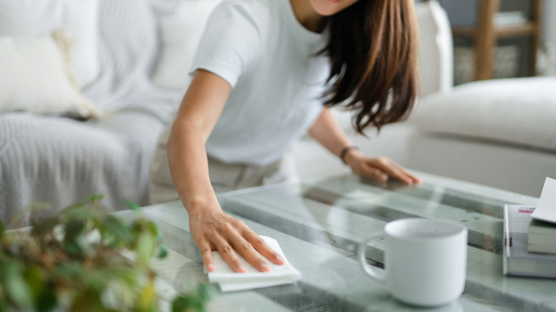 woman cleaning table