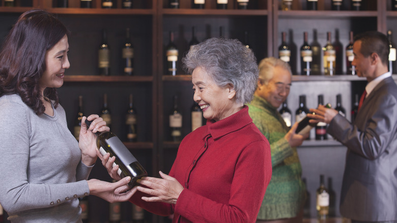 Salepeople customers wine store shelves