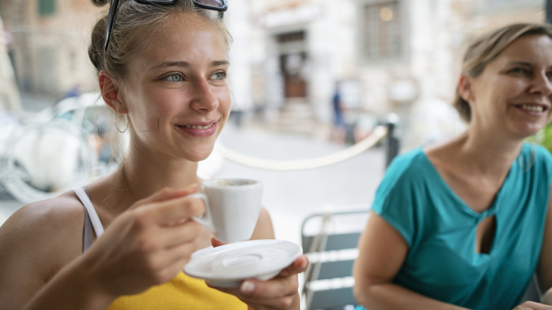 young women drinking coffee