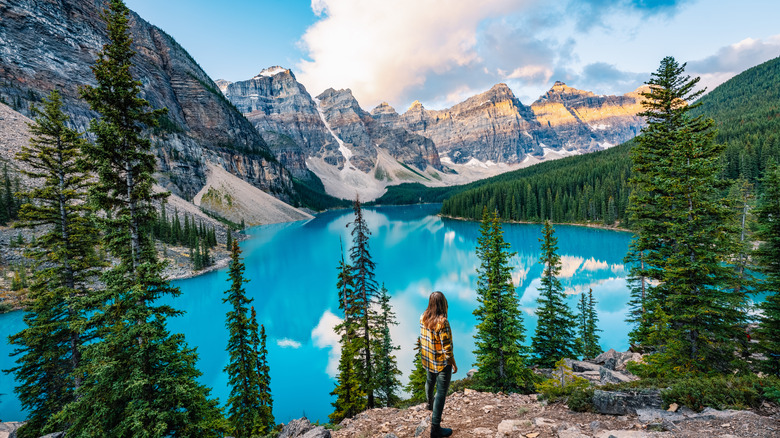 woman standing looking at Morraine Lake in Canada, Banff National Park