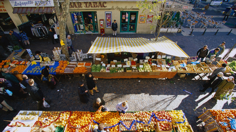 Aerial view of open market in France with people shopping