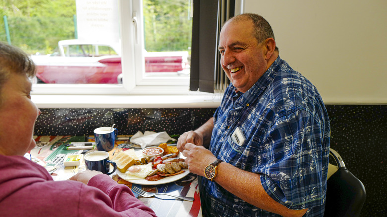 Man eating a full english breakfast