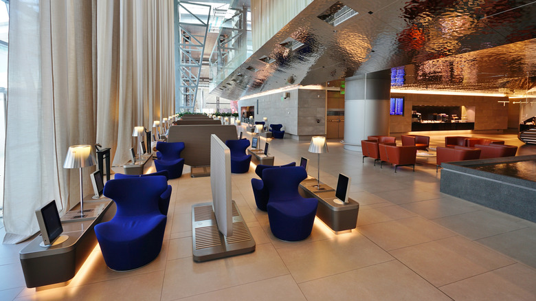 Blue chairs in Qatar Airways' Al Safwa First Lounge.