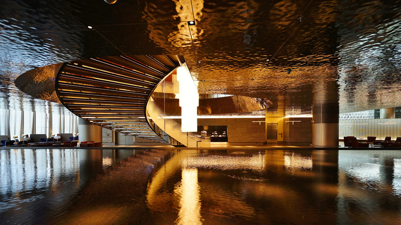 The lobby and staircase of Qatar Airways' first class lounge.