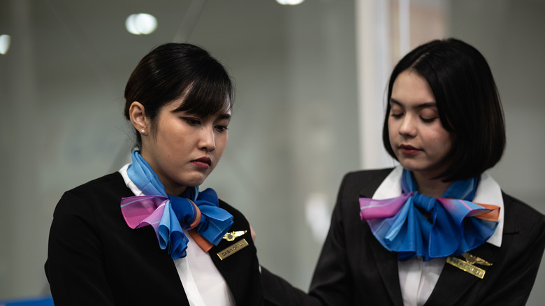 Sad flight attendants