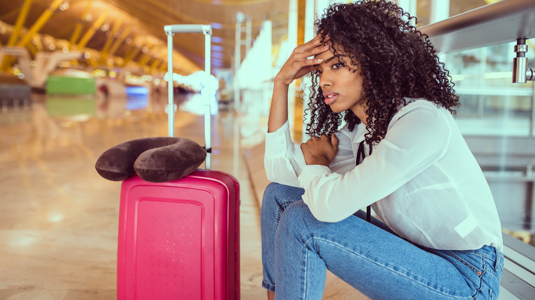 Stressed woman at airport