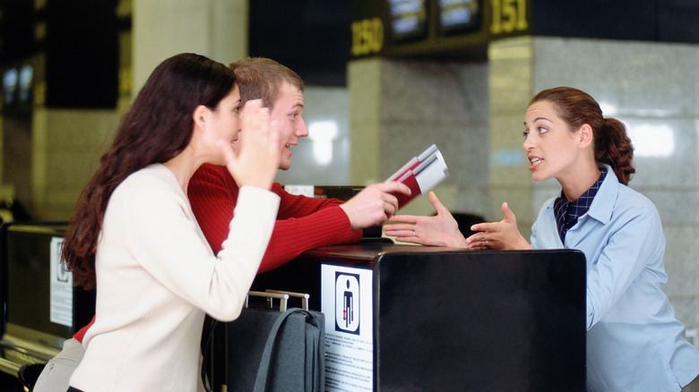 Couple yelling at airline worker