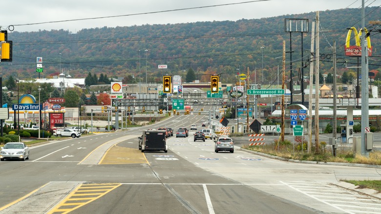 Cars drive through commercial sprawl in Breezewood, Pennsylvania