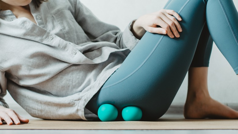 person sitting on massage balls