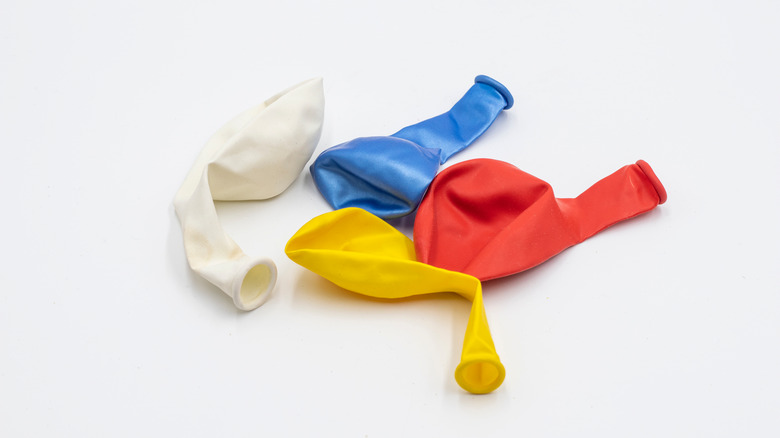 Deflated balloons on surface