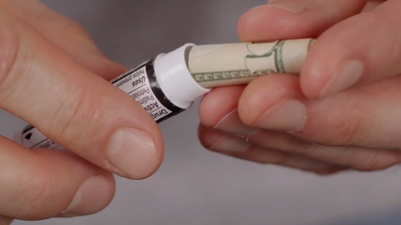 Hiding cash in lip balm tube