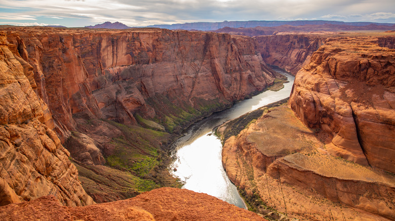 View of the Colorado River at the bottom of the Grand Canyon red rocks galore