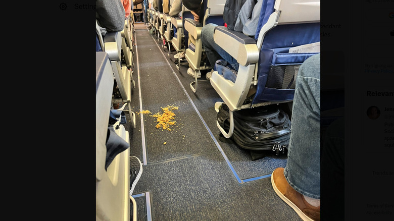 Food spilled in airplane aisle