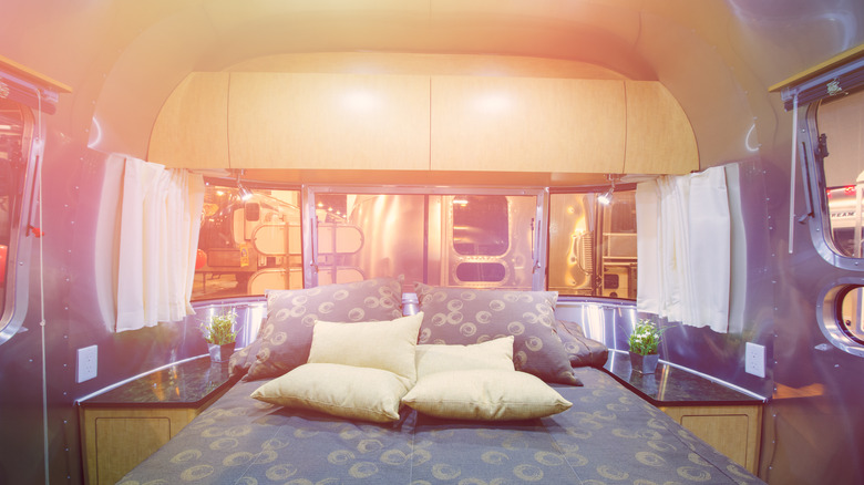 Bed inside glamping airstream