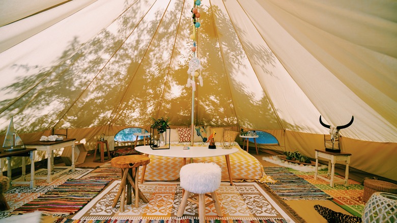 Inside modern glamping canvas tent