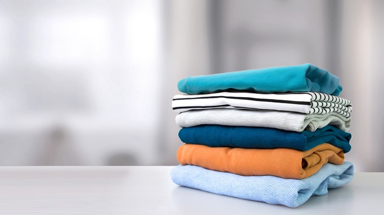 folded clothes on counter