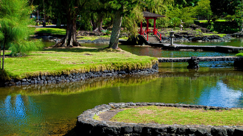 Sculpted waters flow past a red pavilion in Liliuokalani Gardens