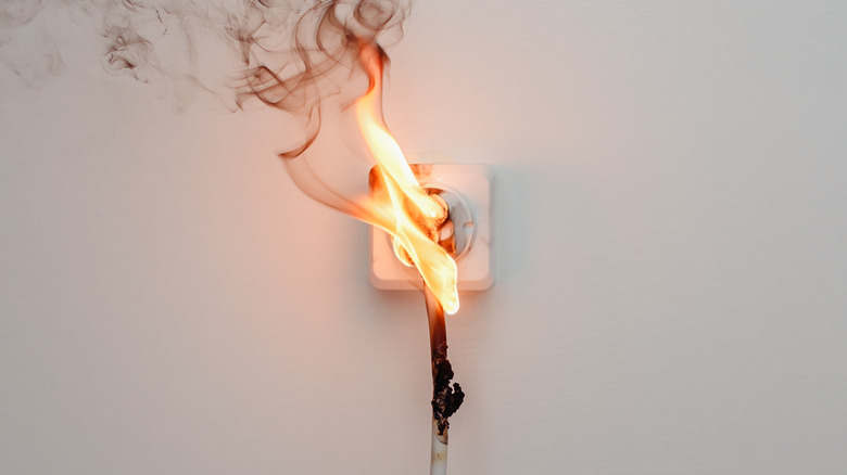 a plug catching fire