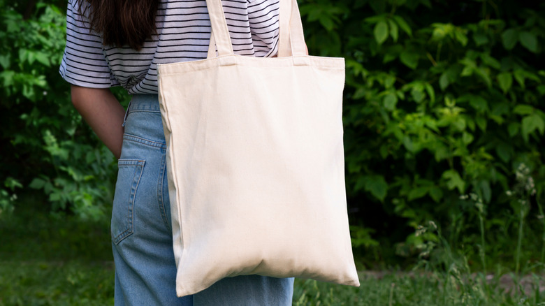 woman holding tote