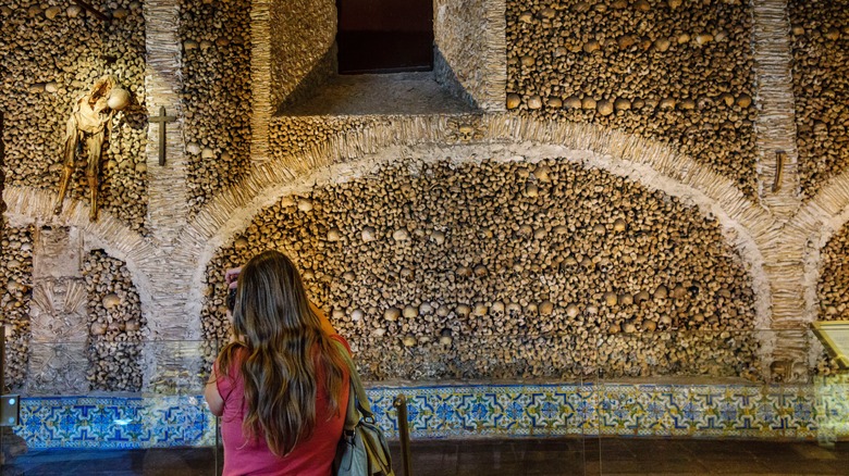 Traveler standing in front of the Chapel of Bones