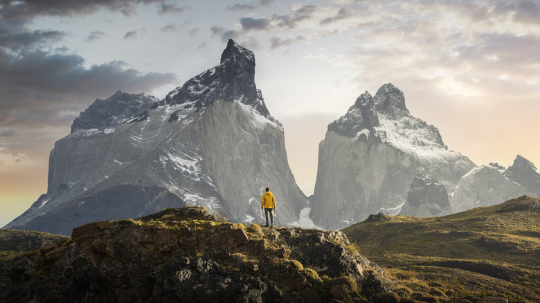 Lone hiker standing on cliff