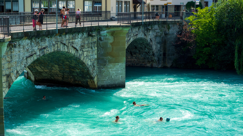 Swimmers near bridge