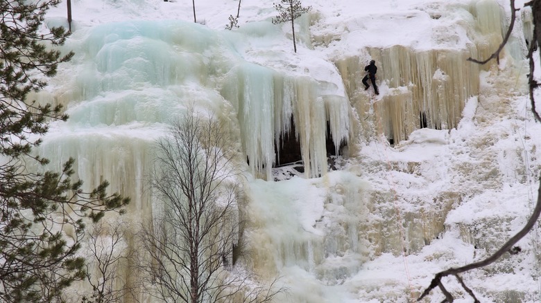 Ice climber ascending frozen Mammuttiputous