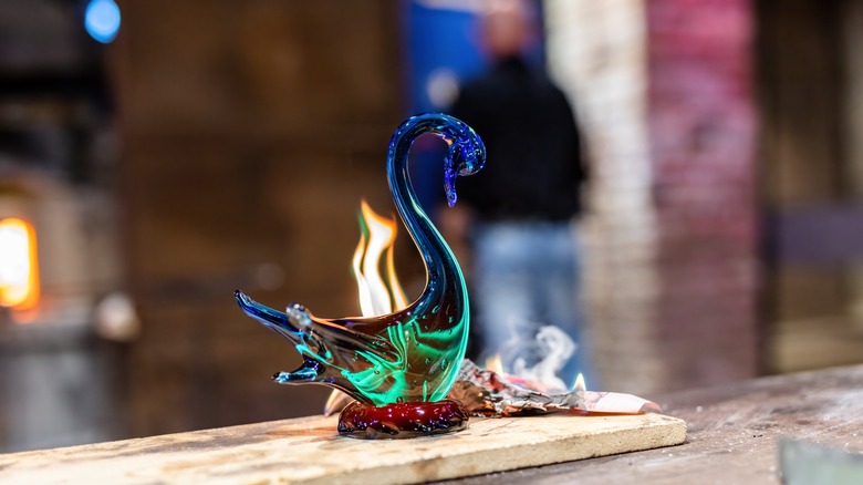 Glassblown swan figurine in workshop