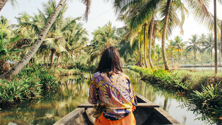 Woman riding boat in asia