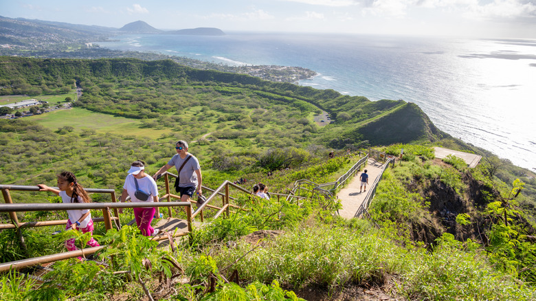 Hikers on a staircase to the Diamond Head crater