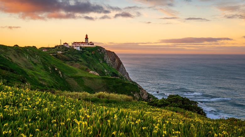 fortress overlooking ocean at sunset