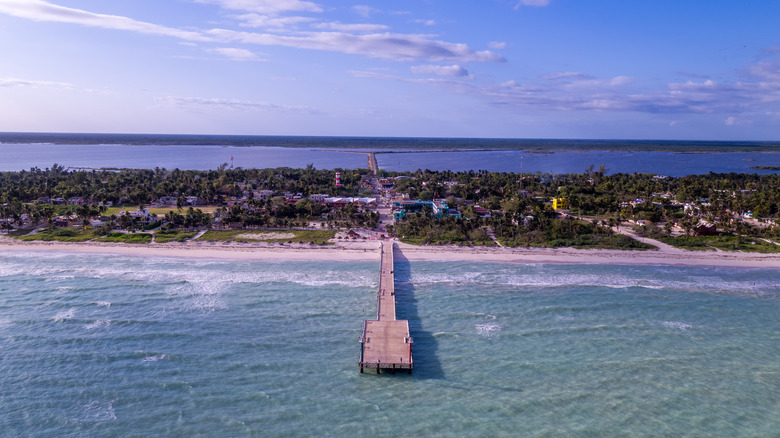 A pier extends into the Caribbean