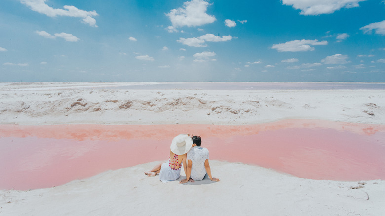 A couple next to the Pink Lagoon