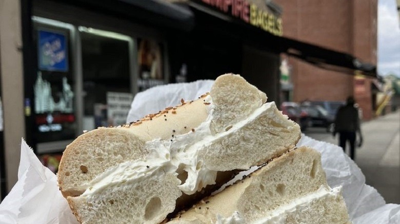 person holding bagels