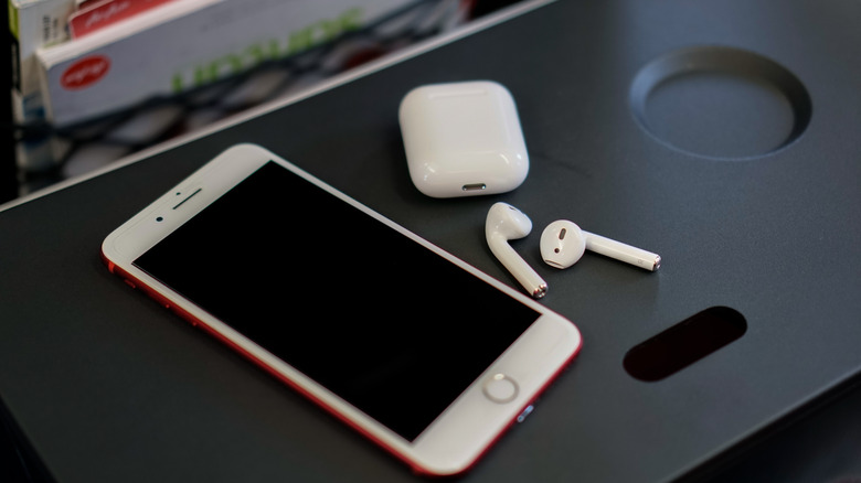AirPods on airplane table tray