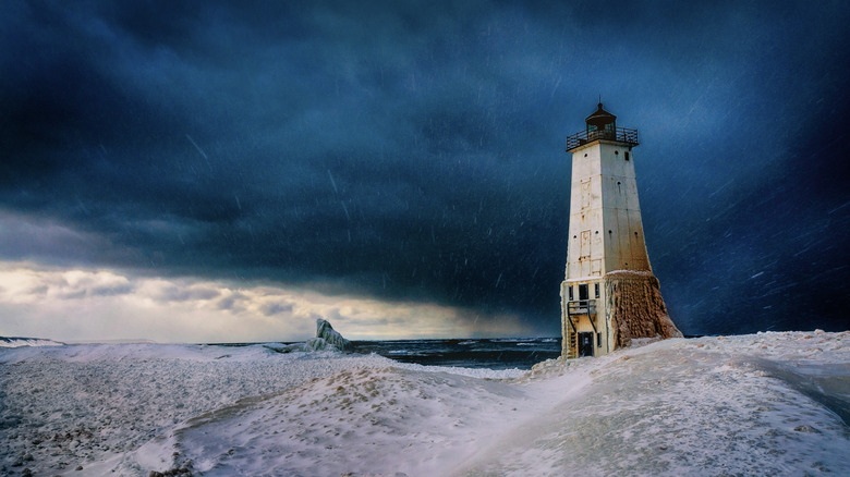 A snowstorm over a lighthouse on Lake Michigan