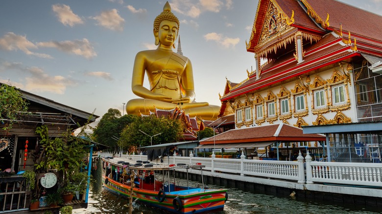 giant gold Buddha and canal
