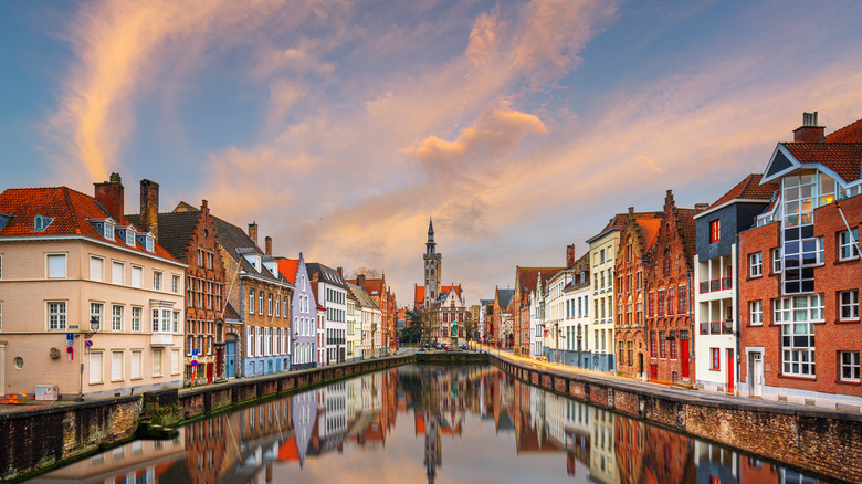 canal between brick buildings in Bruges