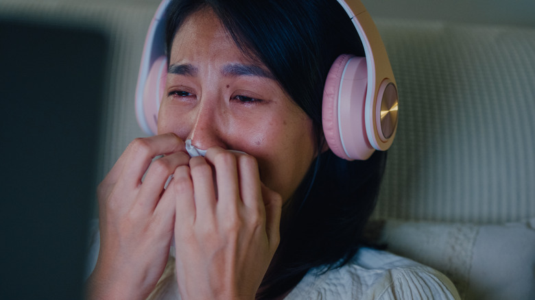female passenger crying on plane