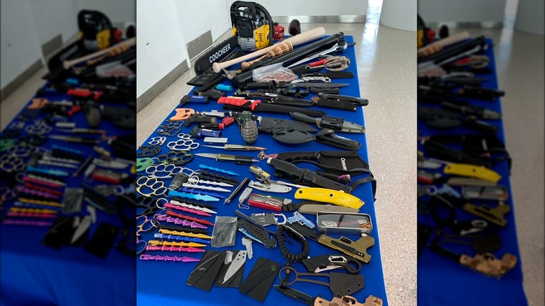 A chainsaw and other confiscated implements